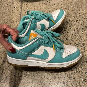 Nike Turquoise and White Sneakers with Orange Accent
